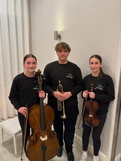 Three of our fantastic musicians representing the Donegal Youth Orchestra (DYO) at the ETBI Joint Forum in Harveys Point last night! 
Well done to Julia McAllister (Cello), Yaroslav Pavliukov (Trumpet) and Elsie McAllister (Violin) 🎶🎶
*********************************************
Pictured with the three students are (left to right): Martin Gormley (Director of Schools at Donegal ETB), Anne McHugh (Chief Executive at Donegal ETB), and John McIvor (Manager at DMEP)